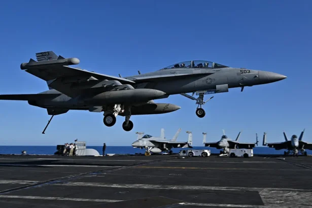 An F/A-18 Hornet fighter jet is seen landing on the deck of the USS Harry S. Truman during a NATO exercise in May 2022. (Andreas Solero/AFP via Getty Images)